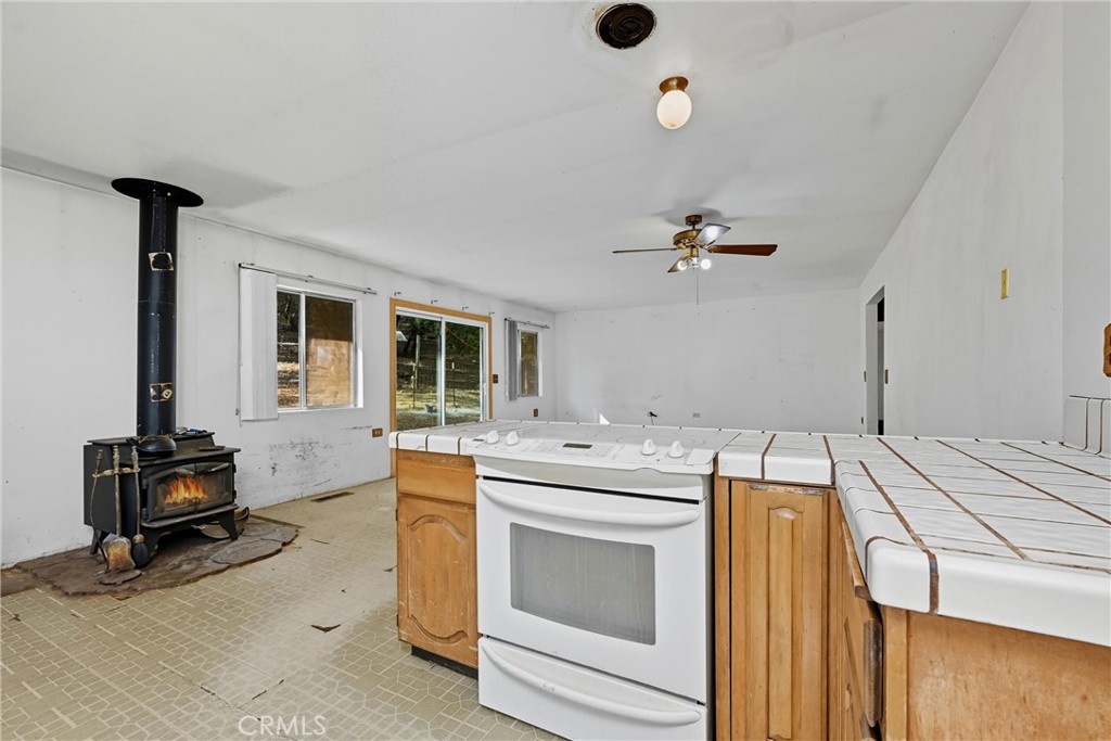 13028 Riata Road Lower Lake, CA 95457 - Photo 10 of 40 a view of a kitchen with a sink and washing machine