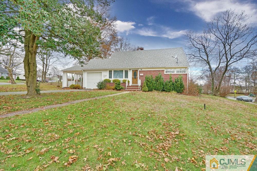 38 Montview Road Edison, NJ 08837 - Photo 2 of 25 a front view of house with yard and green space