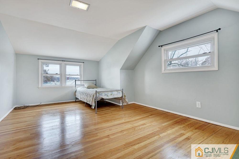 38 Montview Road Edison, NJ 08837 - Photo 18 of 25 a view of an empty room with a window and wooden floor