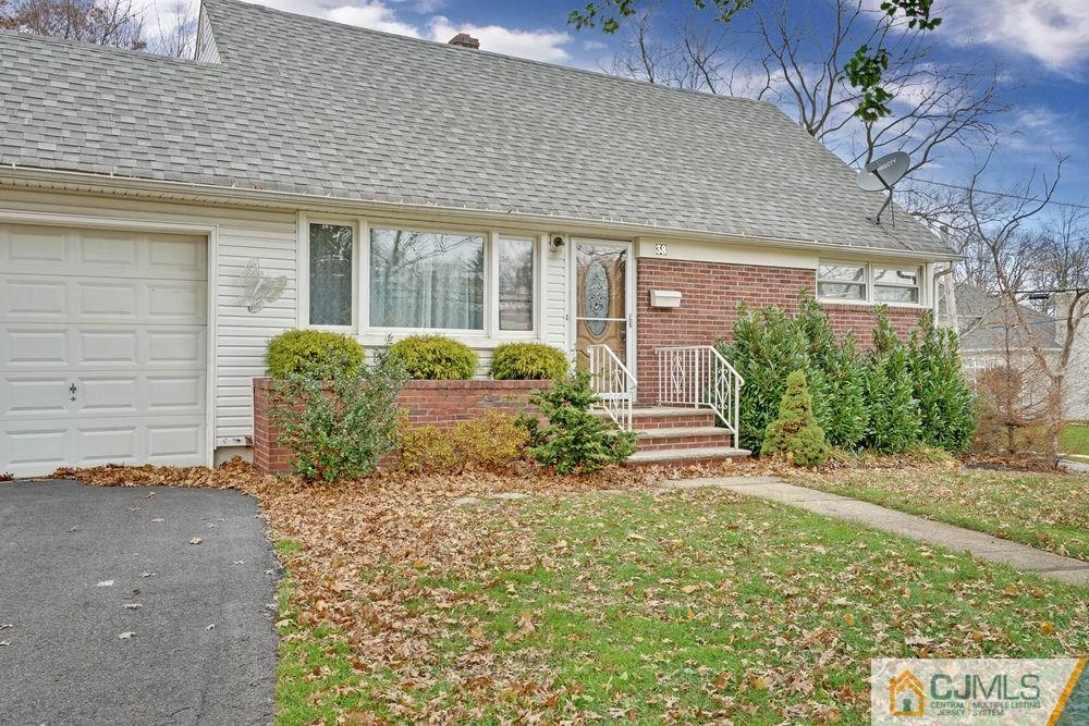 38 Montview Road Edison, NJ 08837 - Photo 3 of 25 a front view of a house with garden
