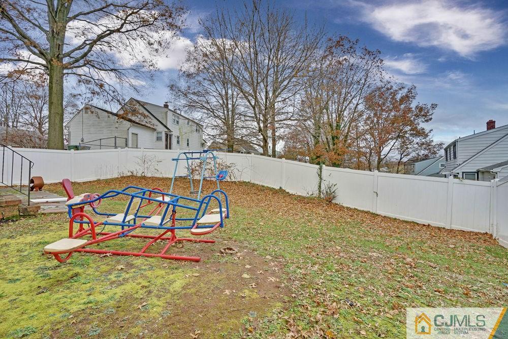 38 Montview Road Edison, NJ 08837 - Photo 23 of 25 a backyard of a house with table and chairs