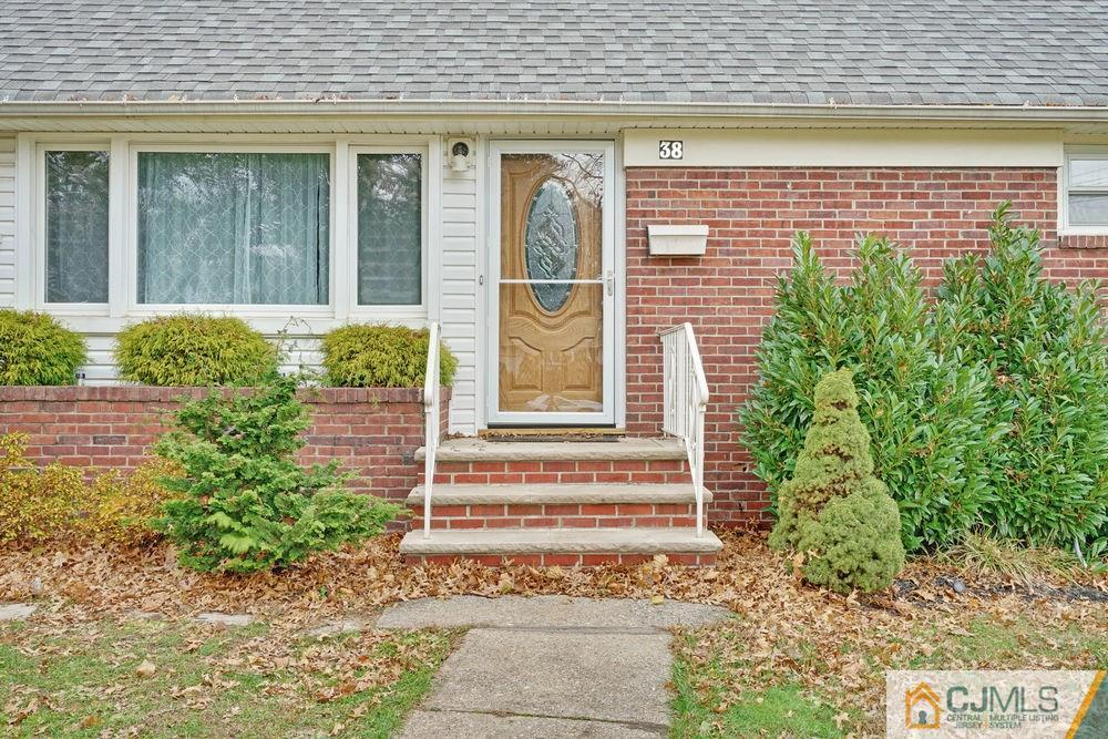 38 Montview Road Edison, NJ 08837 - Photo 4 of 25 a front view of a house with plants