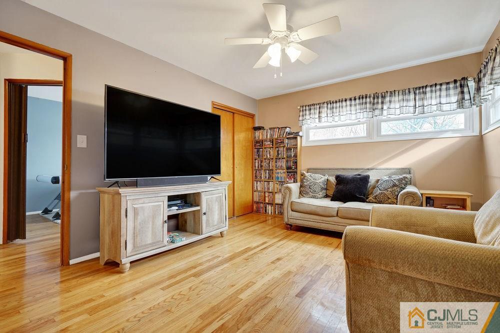 38 Montview Road Edison, NJ 08837 - Photo 7 of 25 a living room with furniture and a flat screen tv