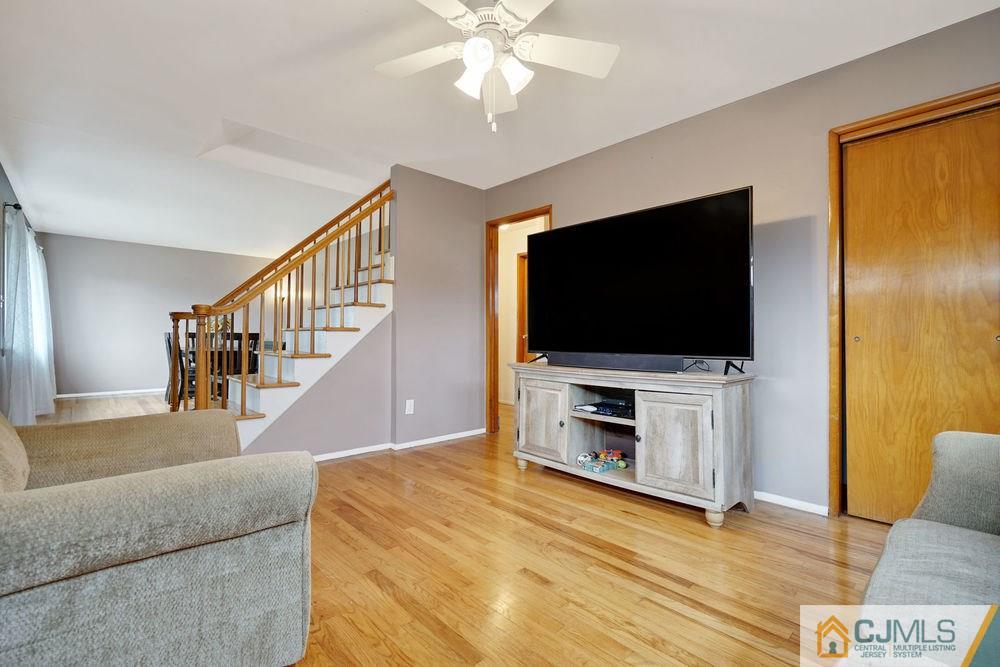 38 Montview Road Edison, NJ 08837 - Photo 9 of 25 a living room with flat screen tv and a flat screen tv