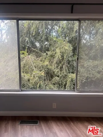 a kitchen with sink stove and cabinets