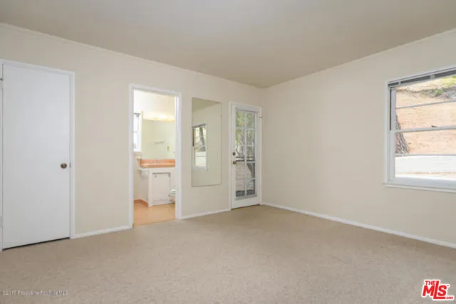 a view of a utility room with closet