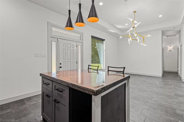 a bathroom with a sink vanity and a mirror