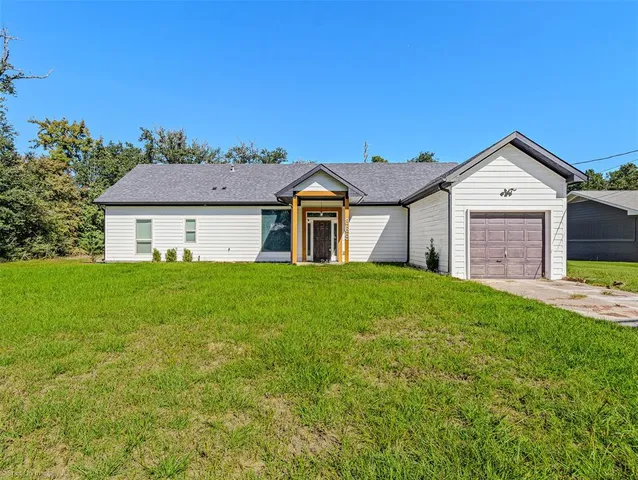 a front view of a house with yard