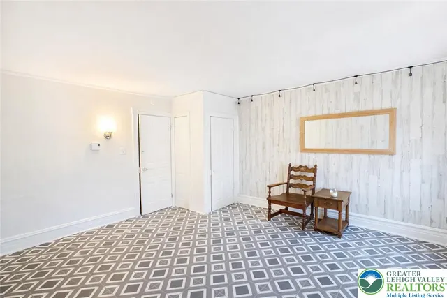 a bedroom with a bed and a table in it