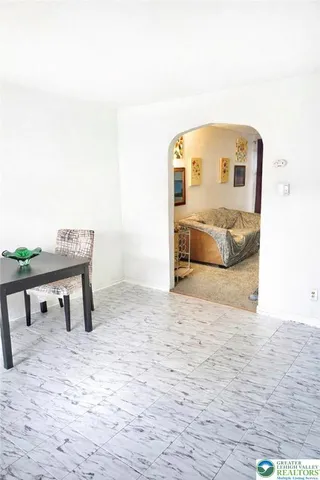 a view of a swimming pool with a chair