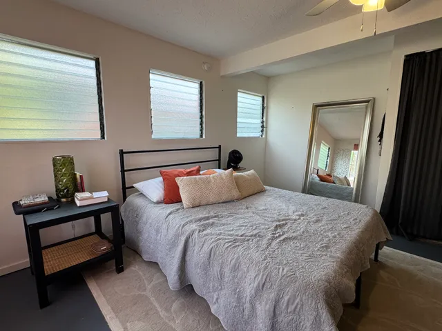 a bedroom with a bed and window