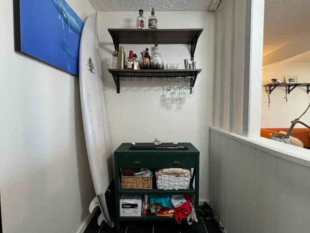 a car parked in a kitchen next to a cabinet