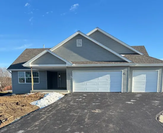 a front view of a house with a garage