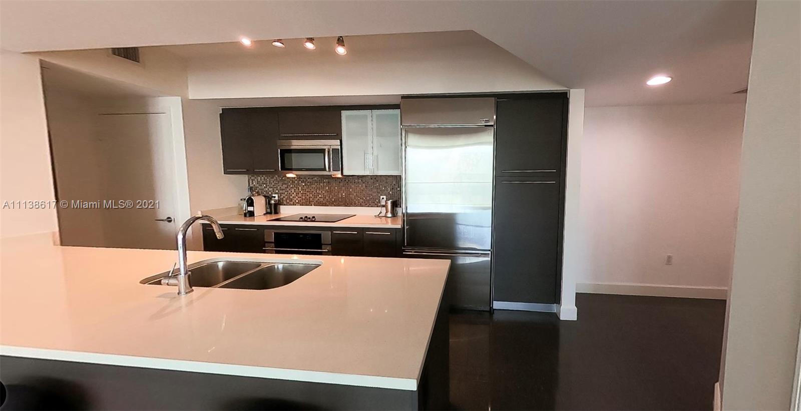a view of living room with granite countertop furniture and fireplace
