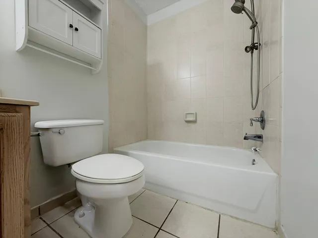 a bathroom with a toilet and a bathtub
