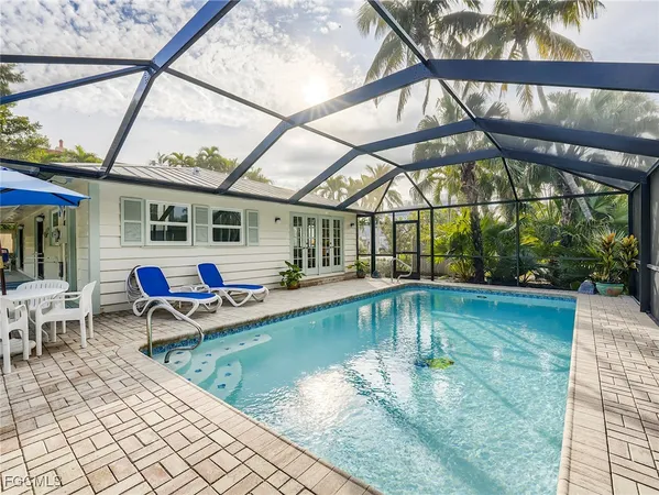 a view of a swimming pool with a patio