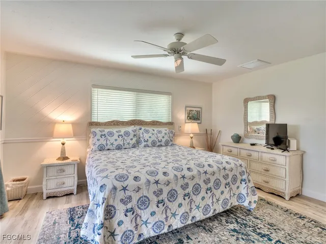 a bedroom with a bed and furniture