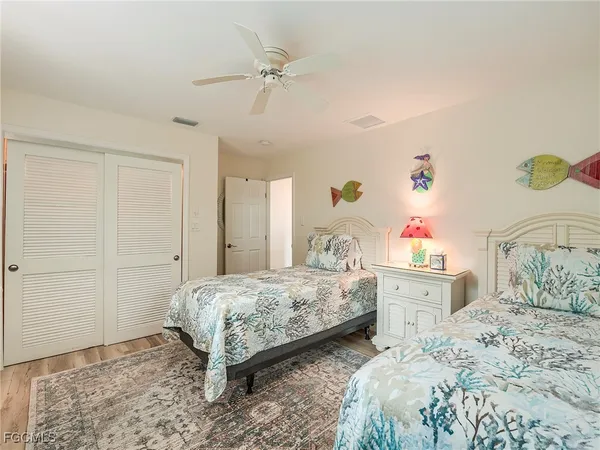 a bedroom with a bed and large window