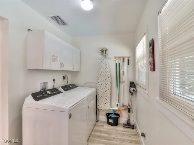 a view of a storage and utility room with closet window