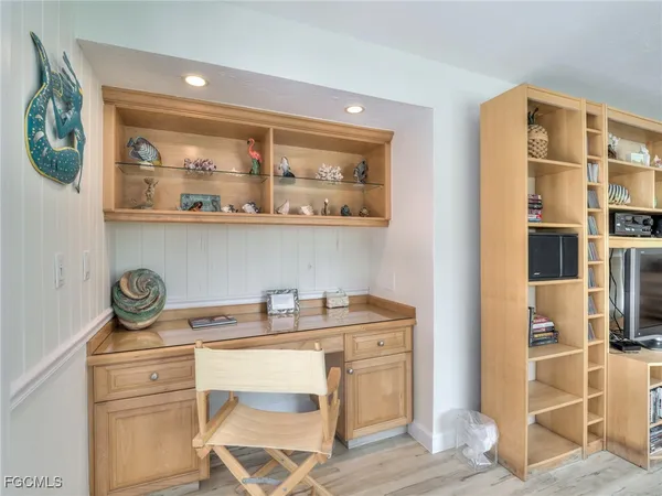 a view of a workspace with furniture