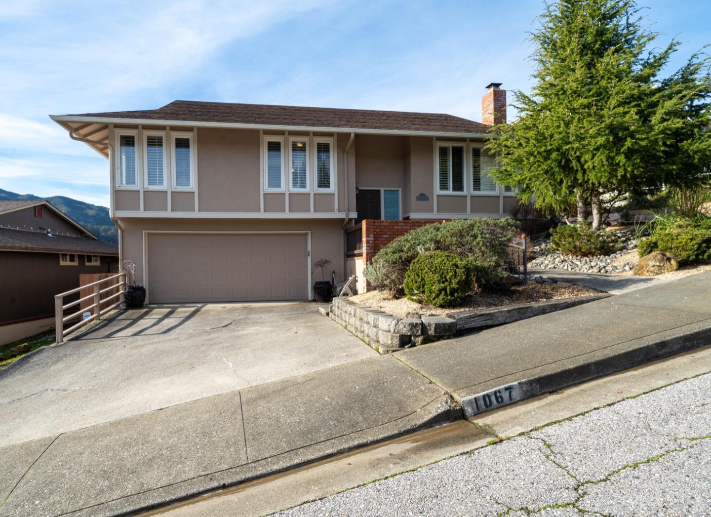 a front view of a house with garage