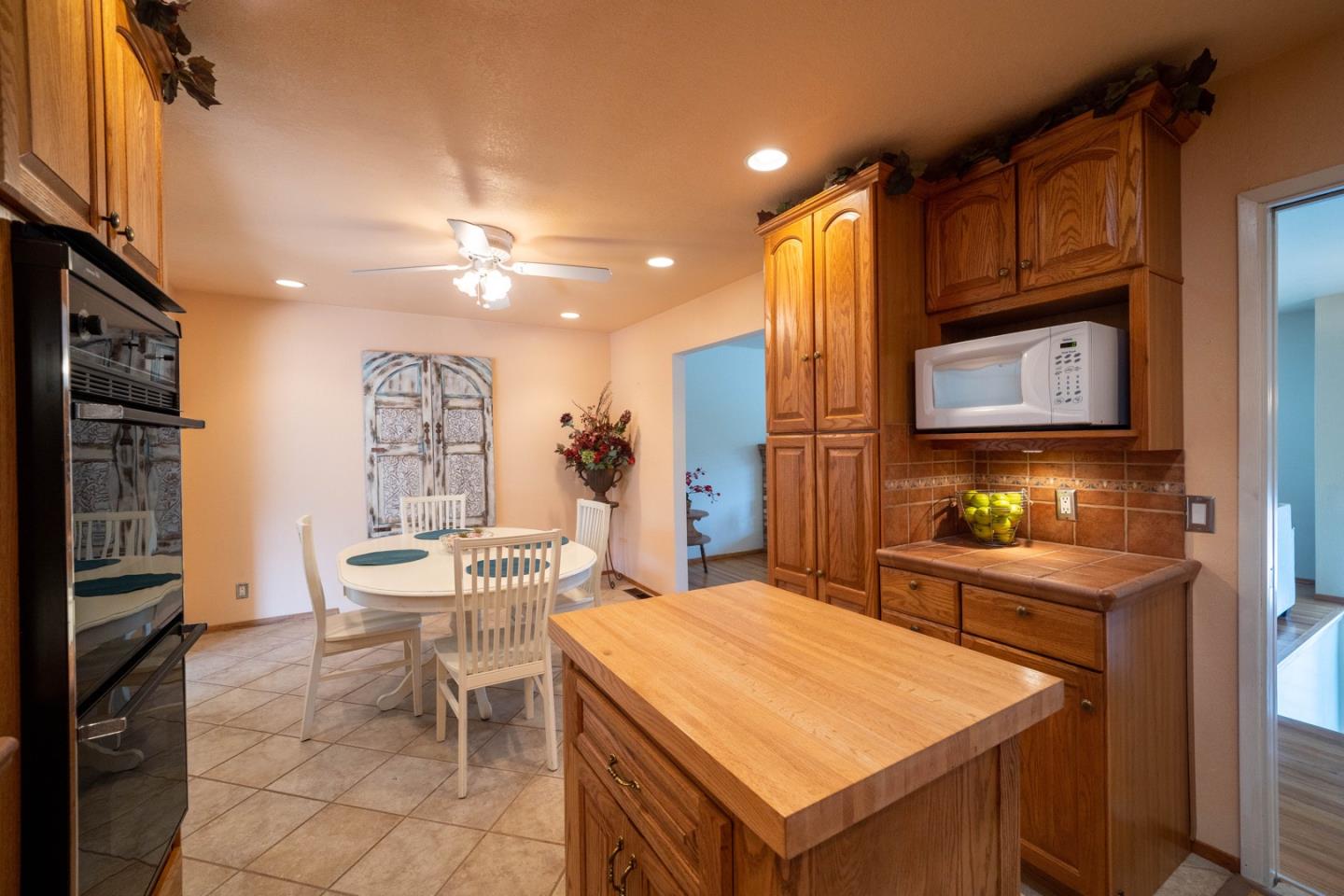 1067 Park Pacifica Avenue Pacifica, CA 94044 - Photo 11 of 25 a kitchen with a cabinets and chairs