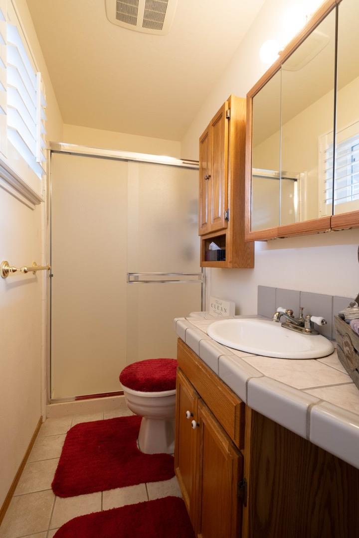 1067 Park Pacifica Avenue Pacifica, CA 94044 - Photo 19 of 25 a bathroom with a sink and a mirror