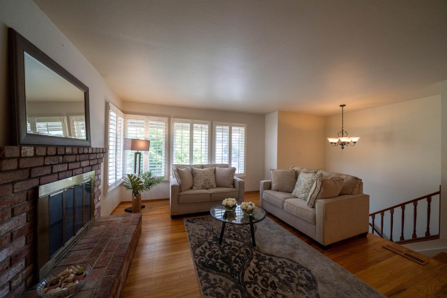 1067 Park Pacifica Avenue Pacifica, CA 94044 - Photo 5 of 25 a living room with furniture and a fireplace