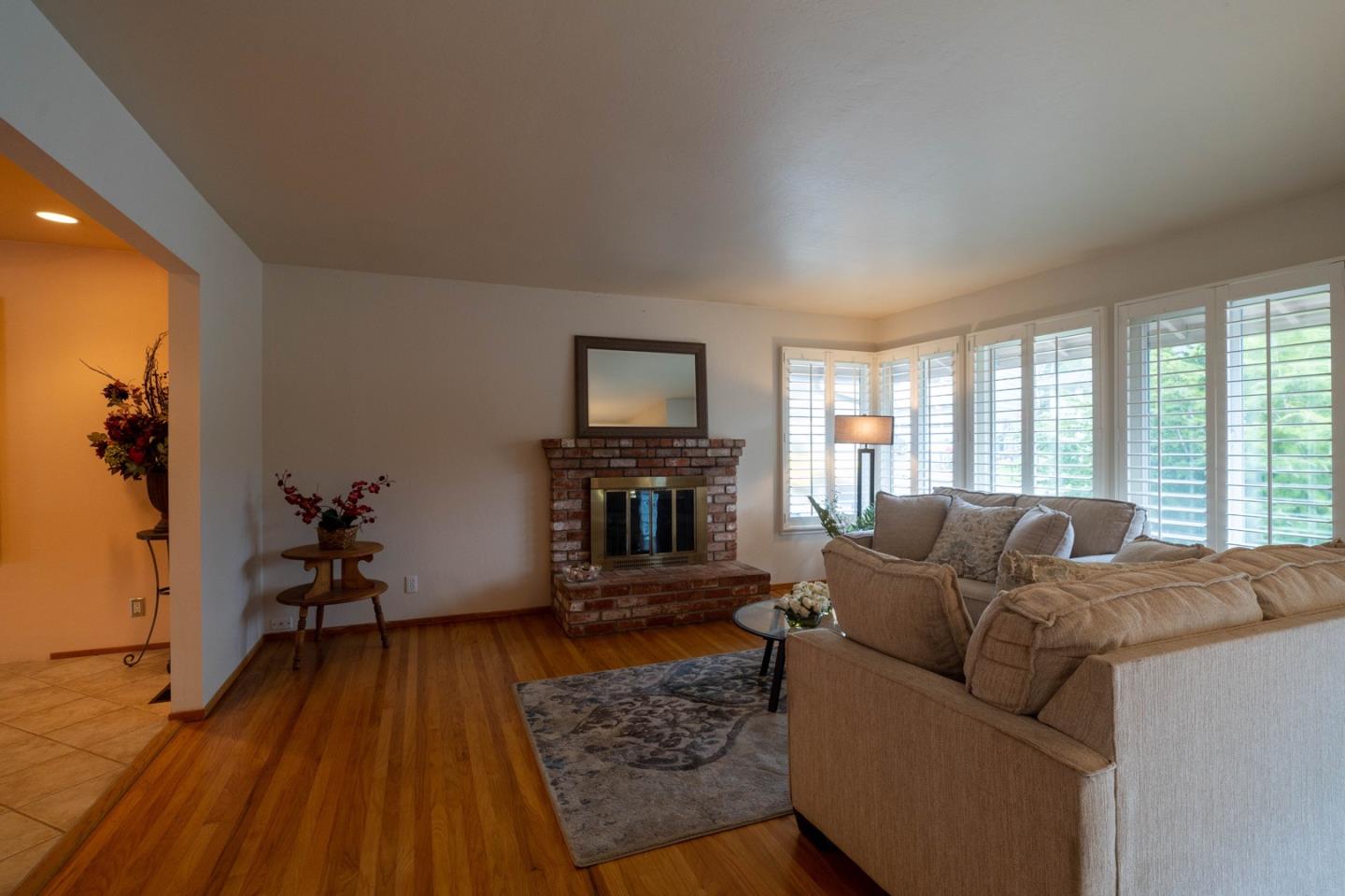 1067 Park Pacifica Avenue Pacifica, CA 94044 - Photo 7 of 25 a living room with furniture and a fireplace