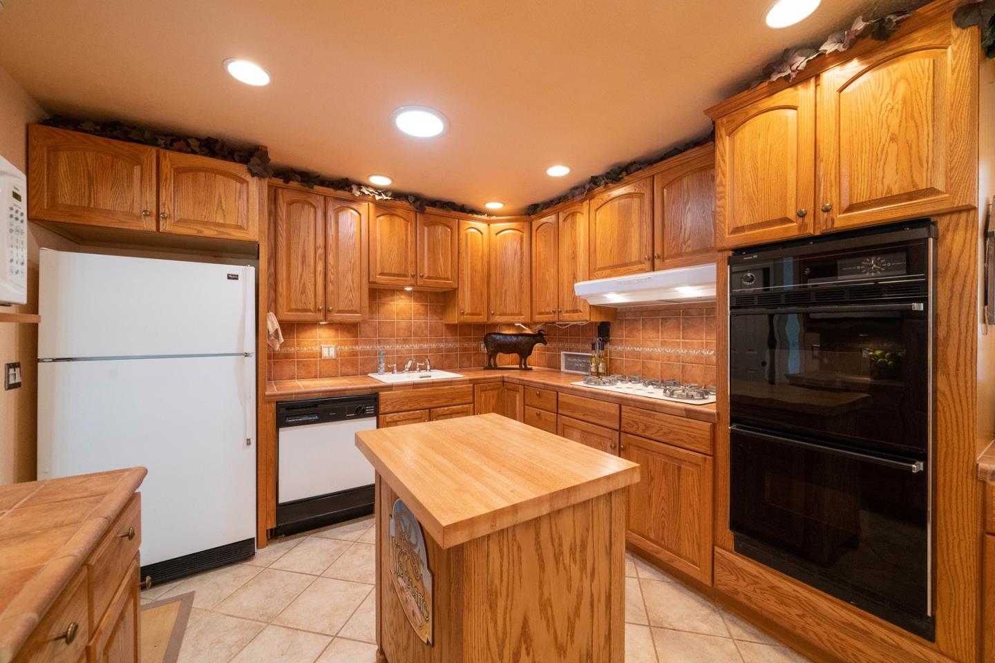 1067 Park Pacifica Avenue Pacifica, CA 94044 - Photo 8 of 25 a kitchen with a refrigerator a stove and a sink