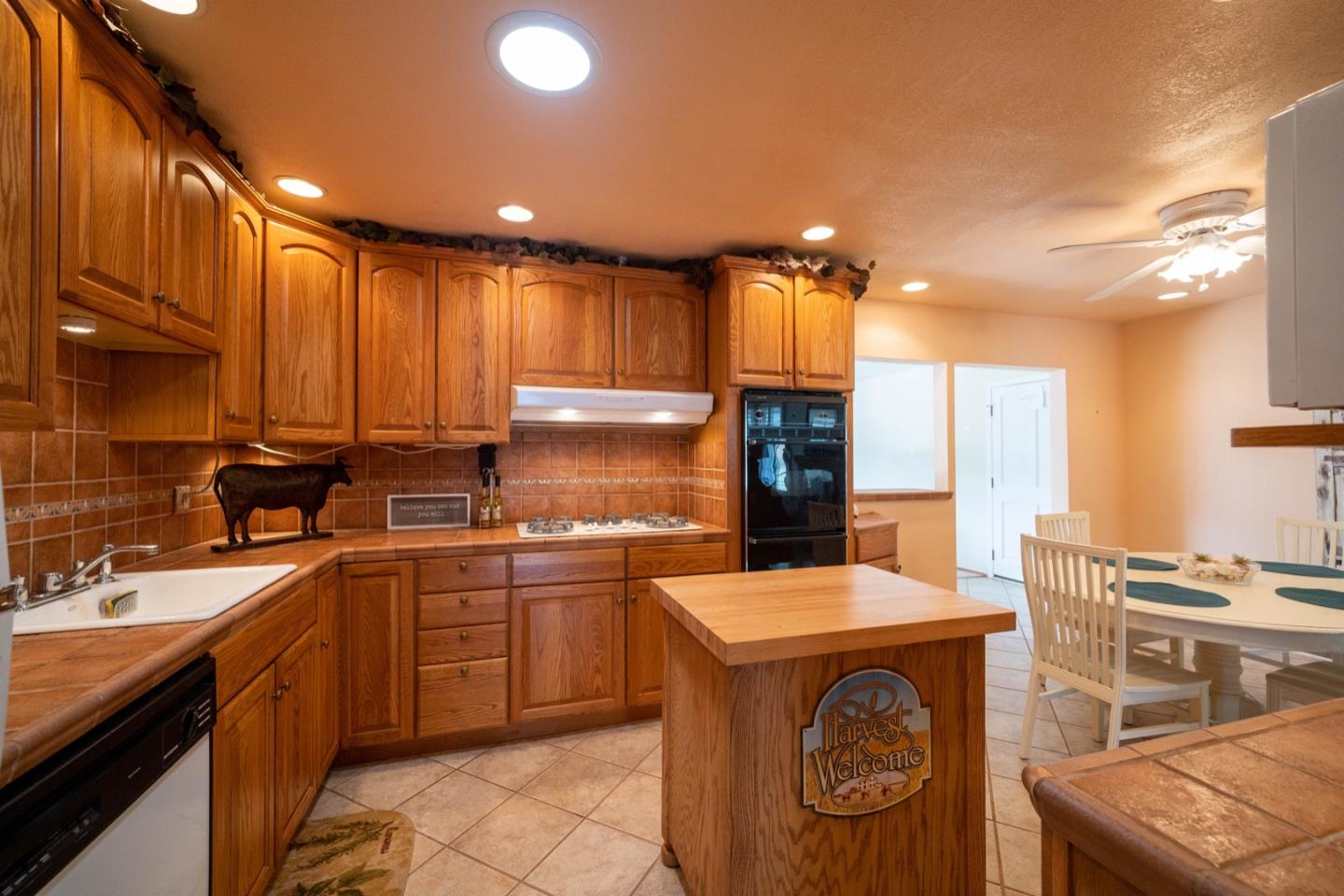 1067 Park Pacifica Avenue Pacifica, CA 94044 - Photo 10 of 25 a kitchen with stainless steel appliances granite countertop a sink a stove and a refrigerator