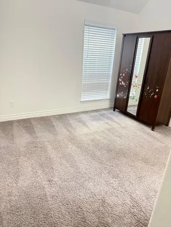 an empty room with large window