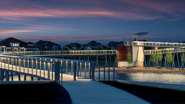 a view of a balcony with an outdoor seating