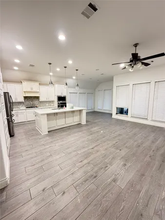 a view of kitchen with wooden floor