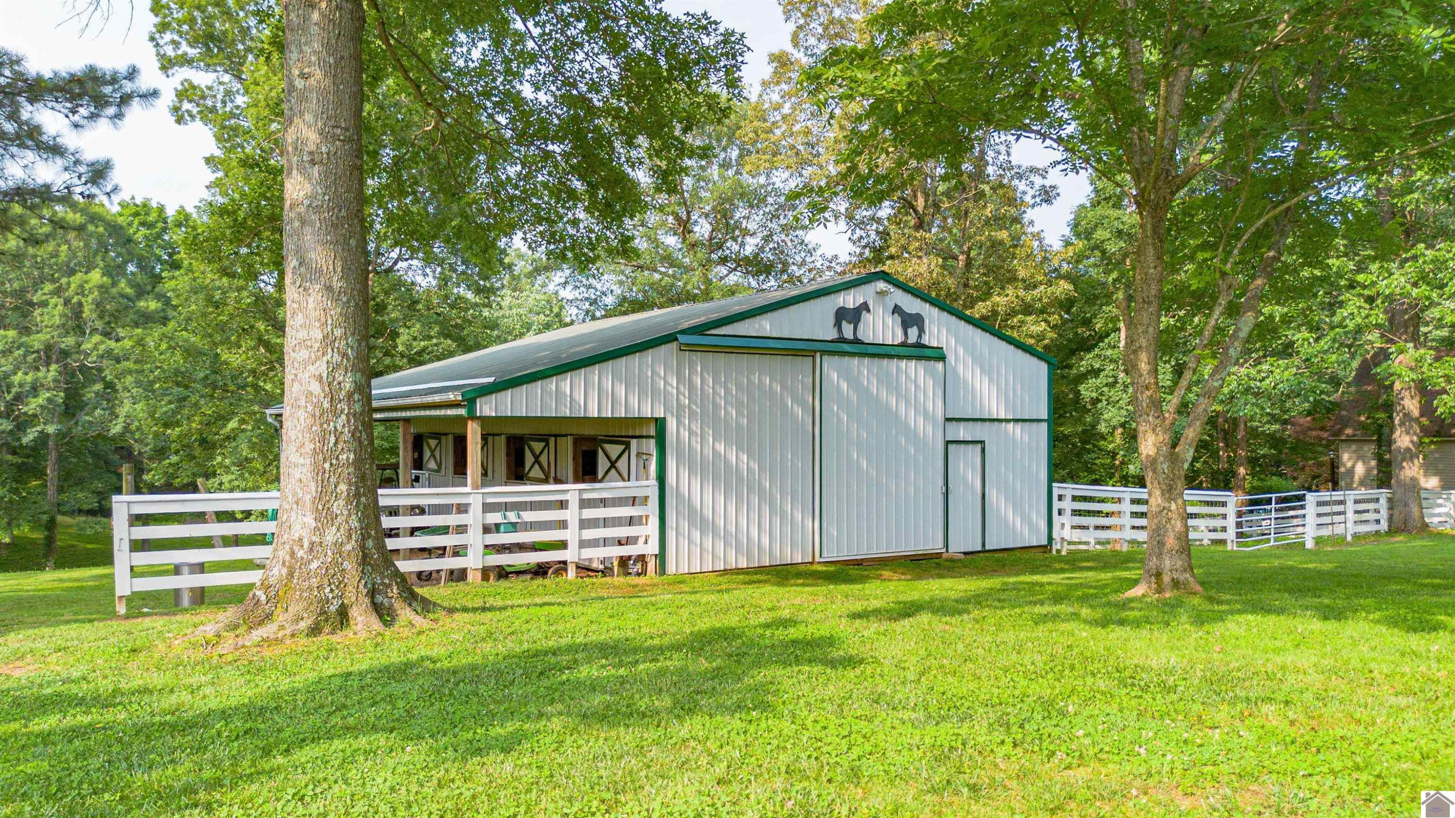 920 Lebanon Church Road Paducah, KY 42003 - Photo 42 of 50 Horse barn with four stalls, tack room, tie room and electric.