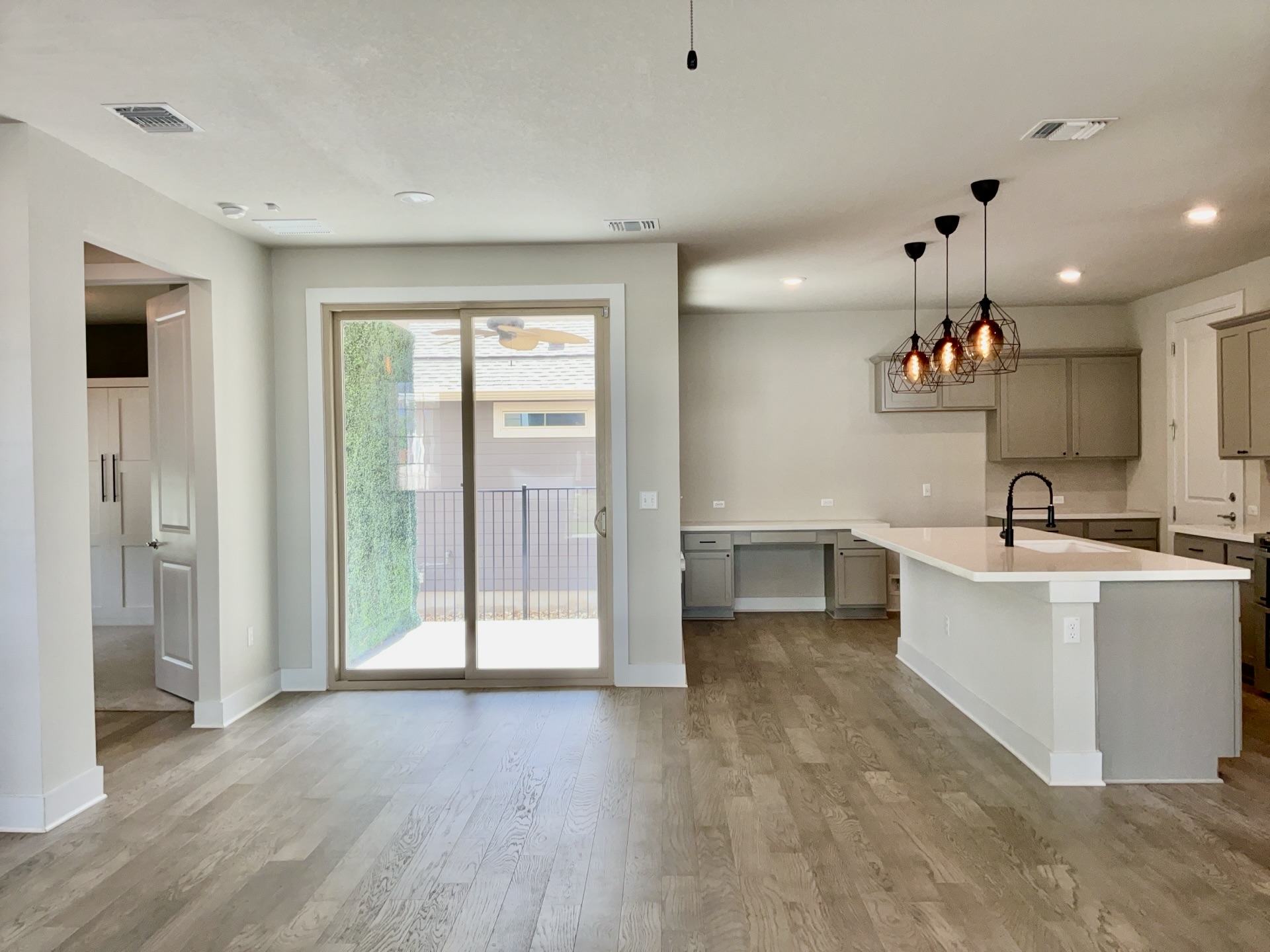 8315 Laughlin Lane Austin, TX 78744 - Photo 4 of 23 a view of a kitchen with a sink hardwood floor and a large window