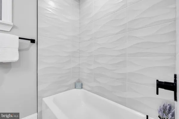 a bathroom with a white tub