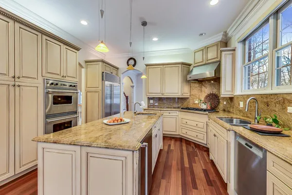 a view of a kitchen cabinets and wooden floor