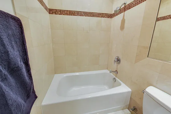 a view of an empty room with a fireplace