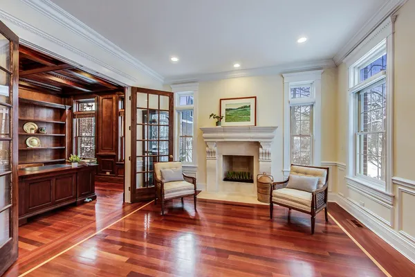 a view of livingroom with furniture a fireplace and wooden floor