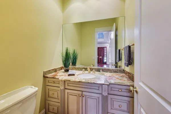 a view of a room with wooden floor chandelier and entryway