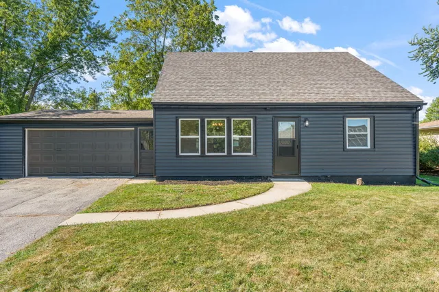 a front view of a house with yard