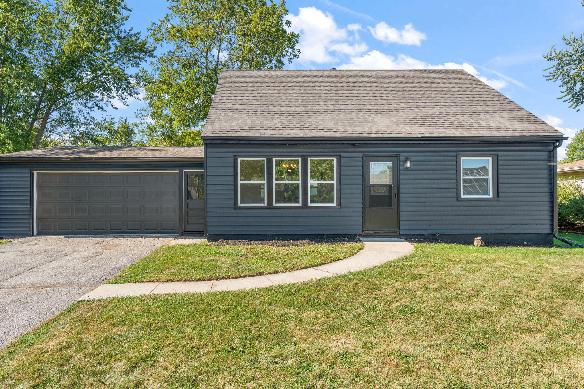 a front view of a house with yard
