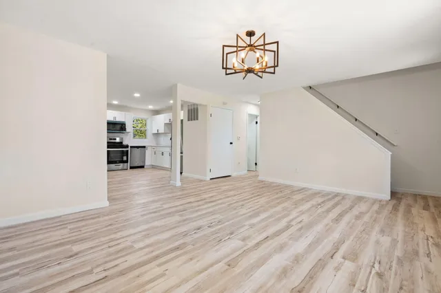 a view of a livingroom with wooden floor