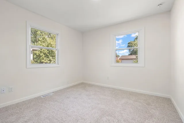 a view of a yard with a tree