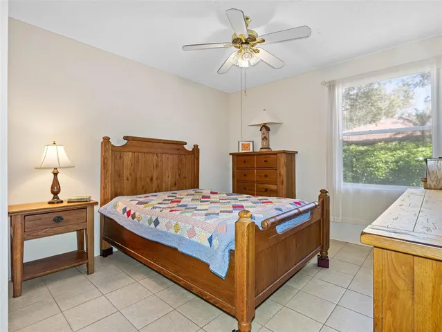 a bedroom with a bed and a table