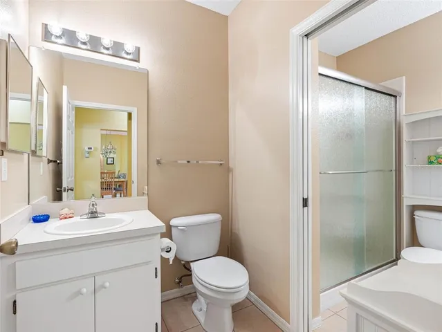 a bathroom with a toilet sink and shower