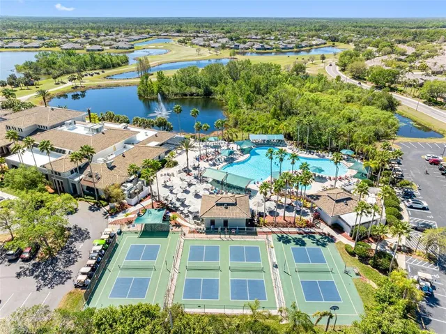 an aerial view of a houses with a lake view