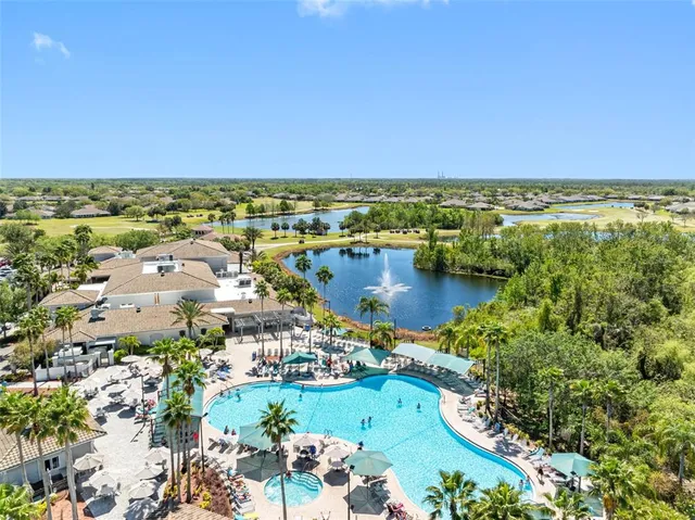 an aerial view of residential houses with outdoor space and street view