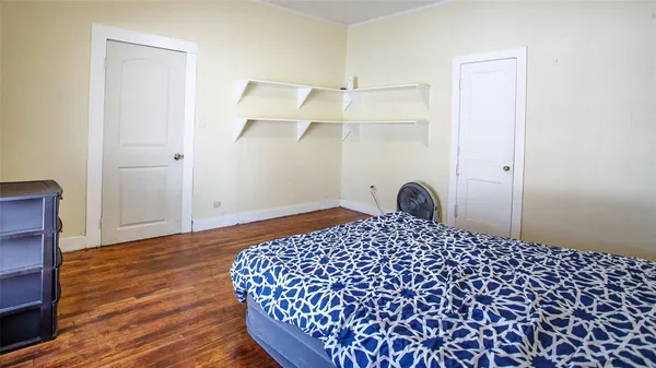 a bedroom with a bed and a table